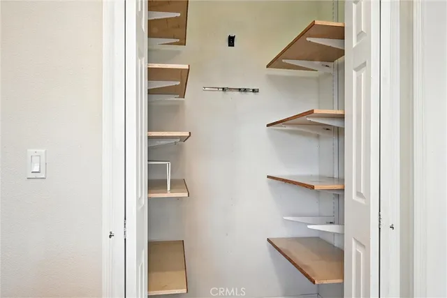 a view of an empty walk in closet