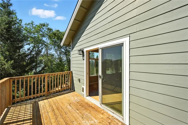 a view of balcony with wooden floor