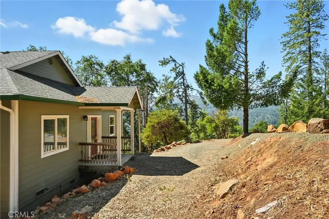 a view of a front of a house with a yard