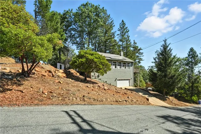 a view of a house with a tree