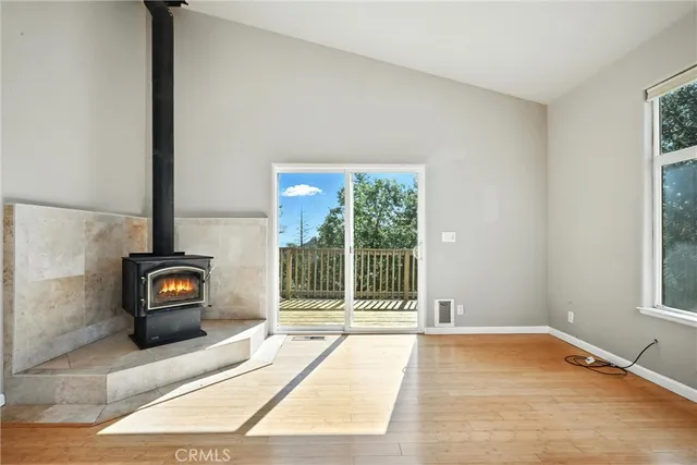 a living room with a couch and a floor to ceiling window