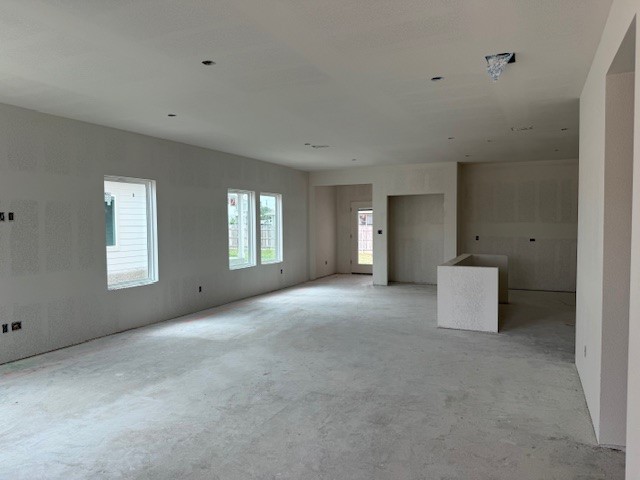 110 Mathew Street Bertram, TX 78605 - Photo 2 of 8 a view of an empty room with a window