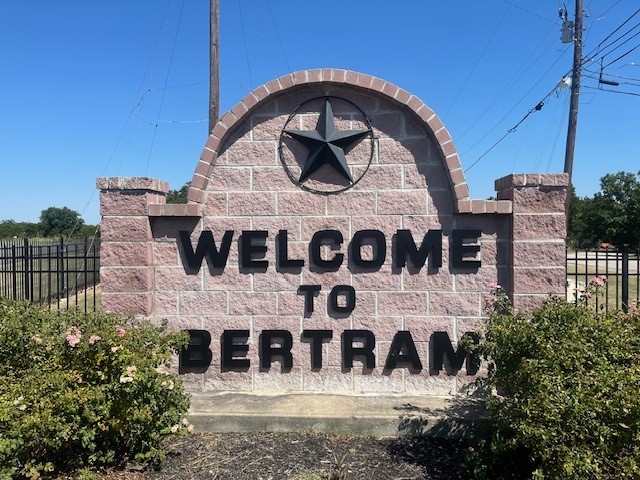 110 Mathew Street Bertram, TX 78605 - Photo 4 of 8 a view of a large building with a sign broad
