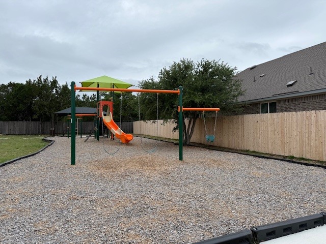 110 Mathew Street Bertram, TX 78605 - Photo 6 of 8 a park with kid zone