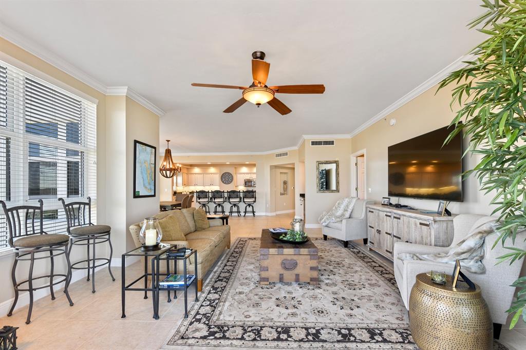 3333 Sunset Key Circle, Unit 407 Punta Gorda, FL 33955 - Photo 11 of 78 a living room with furniture and a flat screen tv