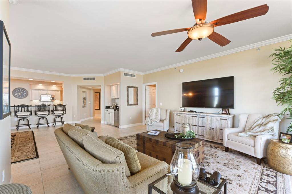 3333 Sunset Key Circle, Unit 407 Punta Gorda, FL 33955 - Photo 12 of 78 a living room with furniture and a flat screen tv