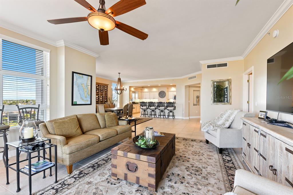 3333 Sunset Key Circle, Unit 407 Punta Gorda, FL 33955 - Photo 13 of 78 a living room with furniture and a window