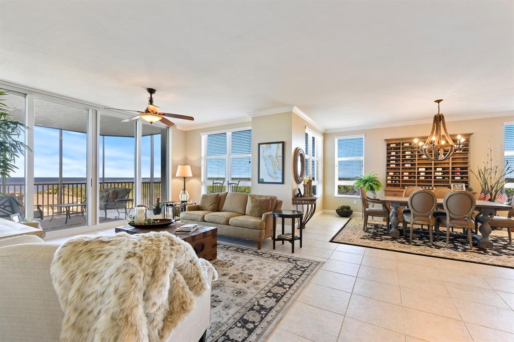 3333 Sunset Key Circle, Unit 407 Punta Gorda, FL 33955 - Photo 14 of 78 a living room with furniture and a large window