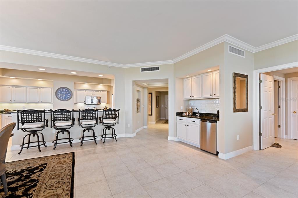 3333 Sunset Key Circle, Unit 407 Punta Gorda, FL 33955 - Photo 25 of 78 a large kitchen with a table and chairs