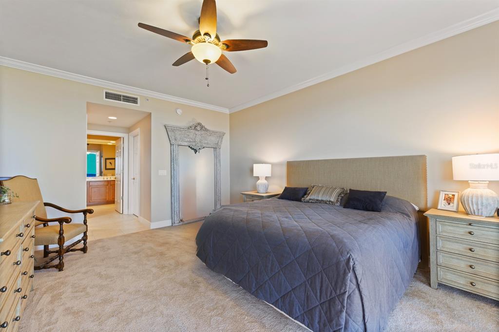 3333 Sunset Key Circle, Unit 407 Punta Gorda, FL 33955 - Photo 30 of 78 a bedroom with a bed a desk and chair