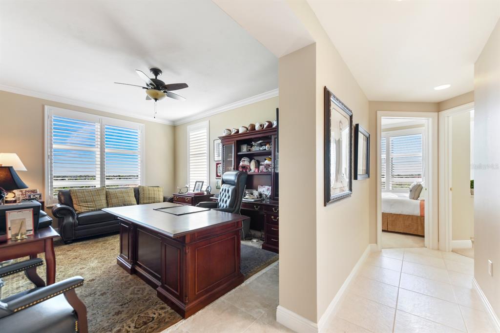 3333 Sunset Key Circle, Unit 407 Punta Gorda, FL 33955 - Photo 36 of 78 a living room with furniture and a open kitchen view