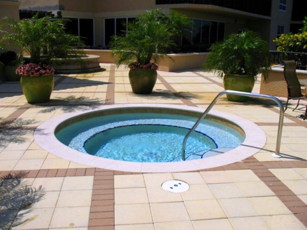 3333 Sunset Key Circle, Unit 407 Punta Gorda, FL 33955 - Photo 53 of 78 a view of a swimming pool with a patio