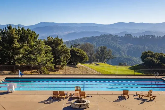 a front view of house with outdoor seating