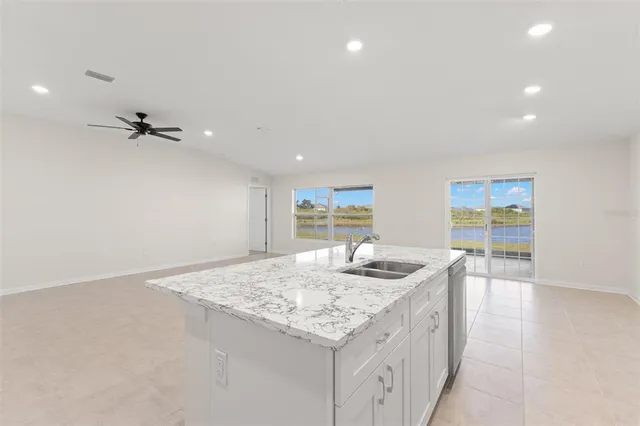 a kitchen with a sink and cabinets