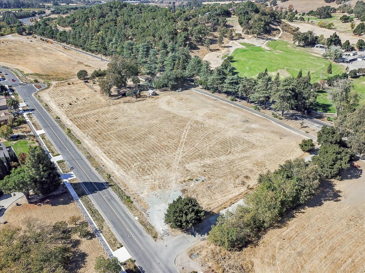 2740 Hecker Pass Road Gilroy, CA 95020 - Photo 11 of 15 a view of a backyard of a house with a mountain