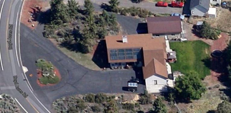 63578 Boyd Acres Road Bend, OR 97701 - Photo 8 of 22 an aerial view of a house with garden