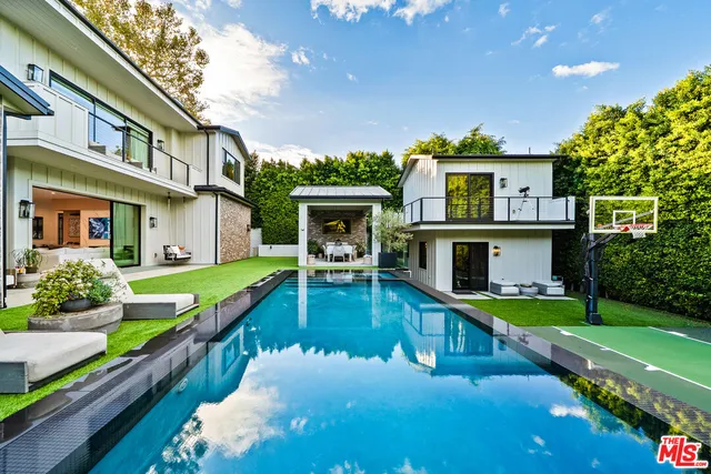 a view of a house with swimming pool
