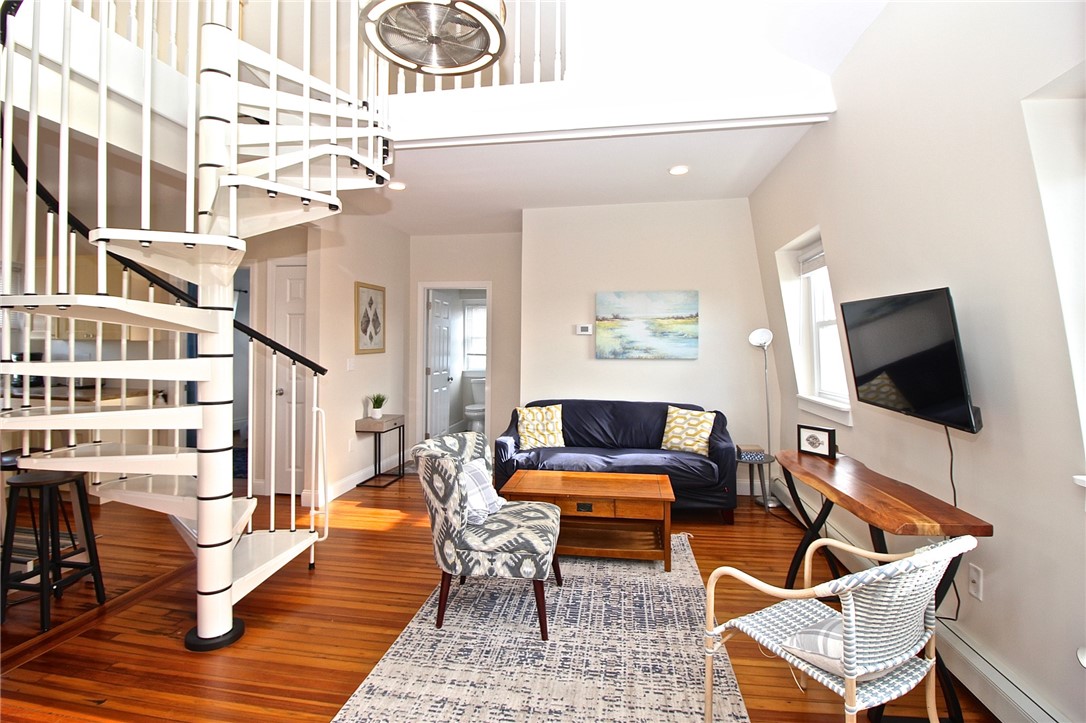 668 Thames Street, Unit 3 Newport, RI 02840 - Photo 11 of 47 Entry View to living room, spiral to loft, bathroom and kitchen