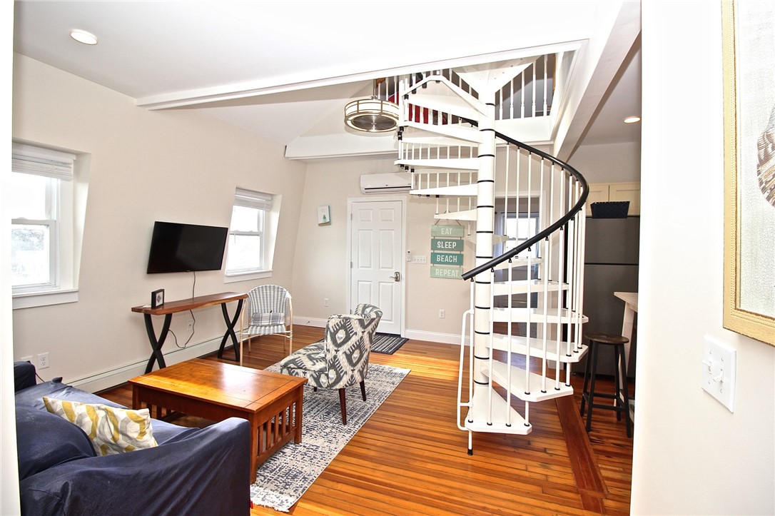 668 Thames Street, Unit 3 Newport, RI 02840 - Photo 14 of 47 view to living room, spiral to loft and front door