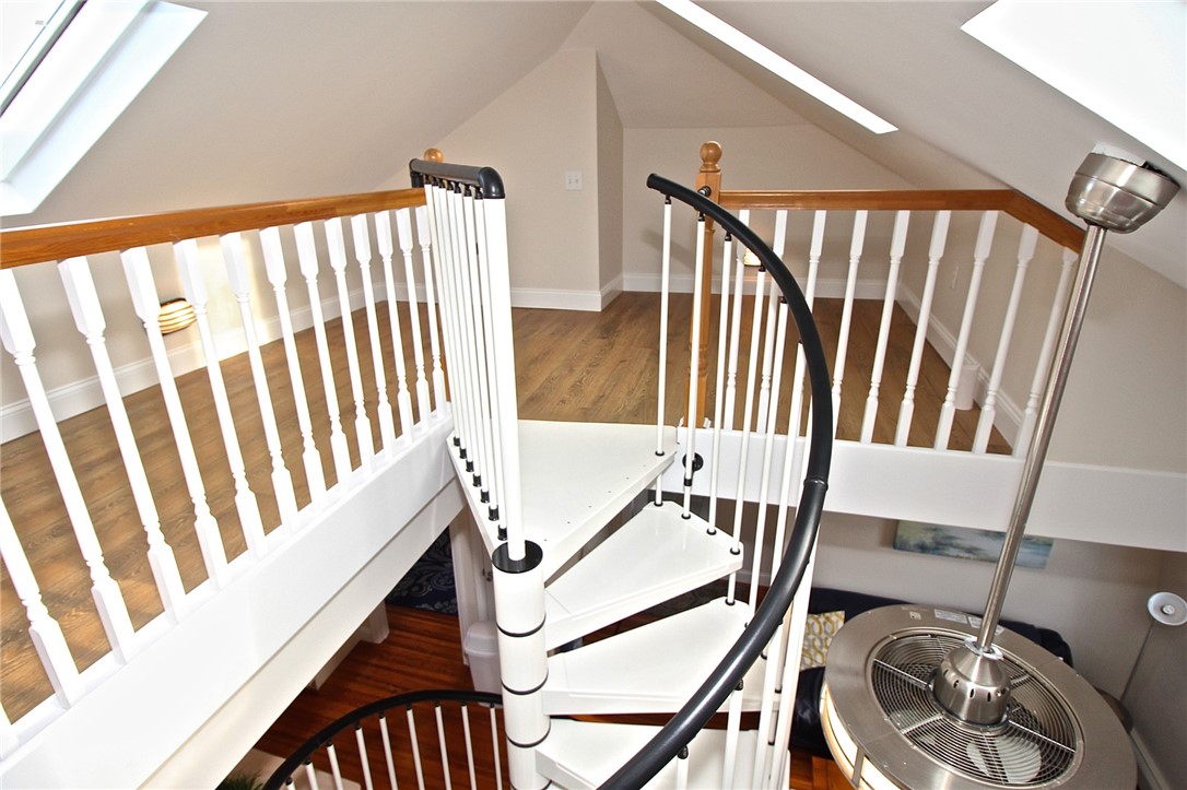 668 Thames Street, Unit 3 Newport, RI 02840 - Photo 33 of 47 Spiral to loft area with wood floors & skylights