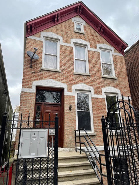 726 West 19th Place, Unit 1 Chicago, IL 60608 - Photo 1 of 7 a front view of a house with stairs