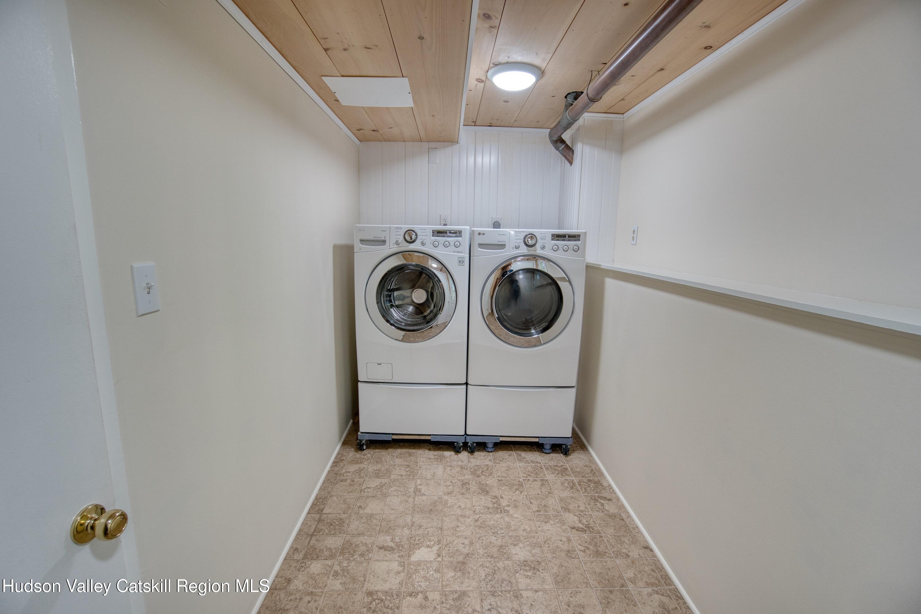 177 Buck Road Stone Ridge, NY 12484 - Photo 23 of 37 a utility room with dryer and washer