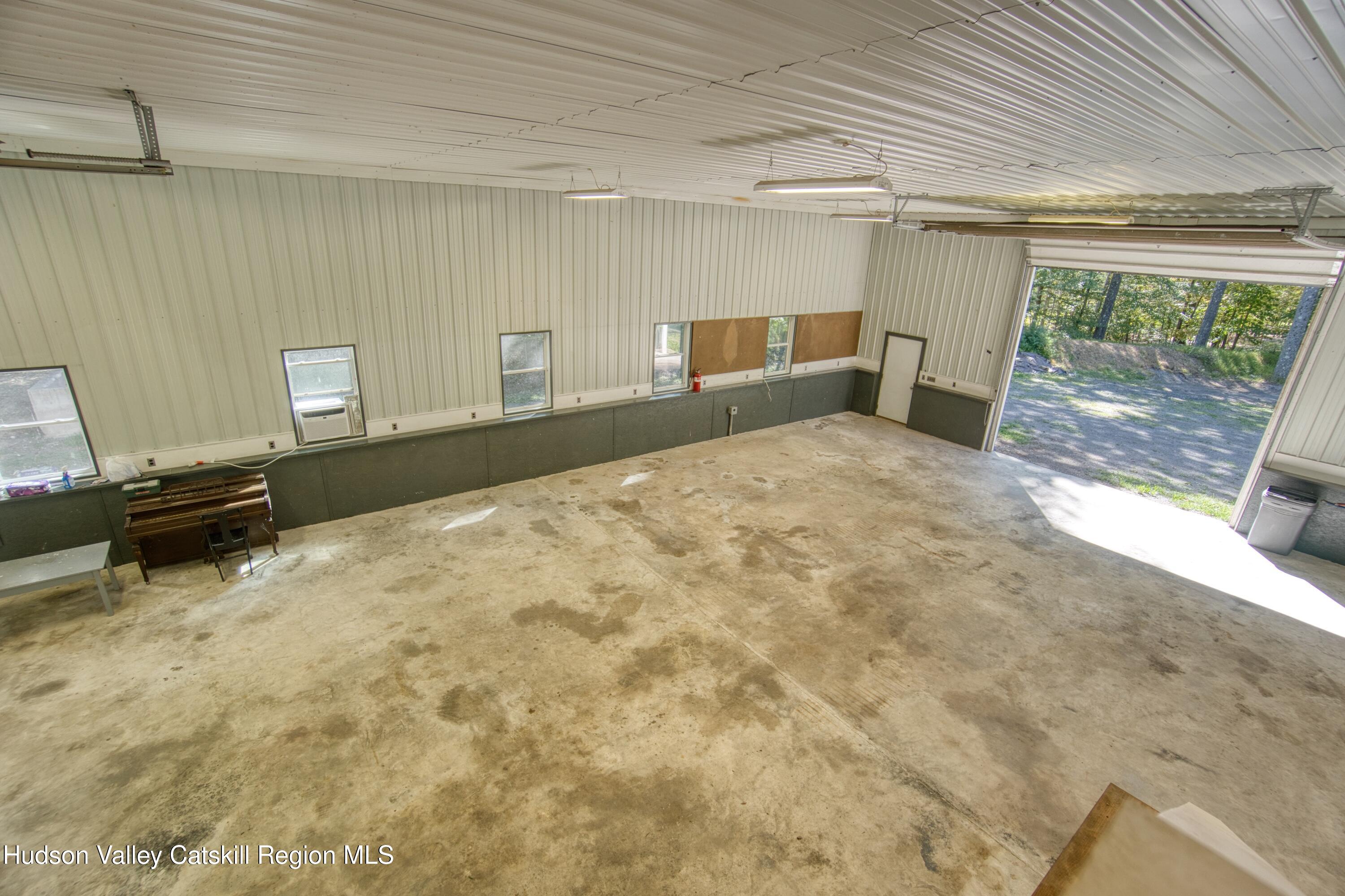 177 Buck Road Stone Ridge, NY 12484 - Photo 34 of 37 a bedroom with a bed and a window