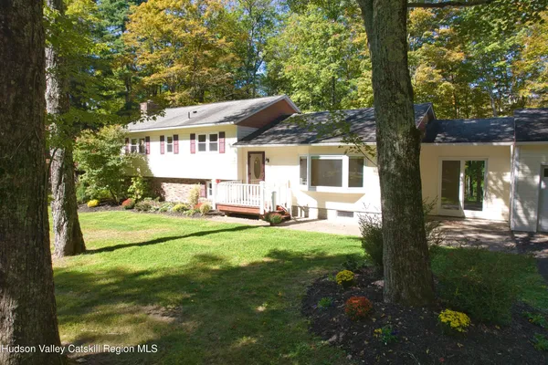 a front view of a house with a yard