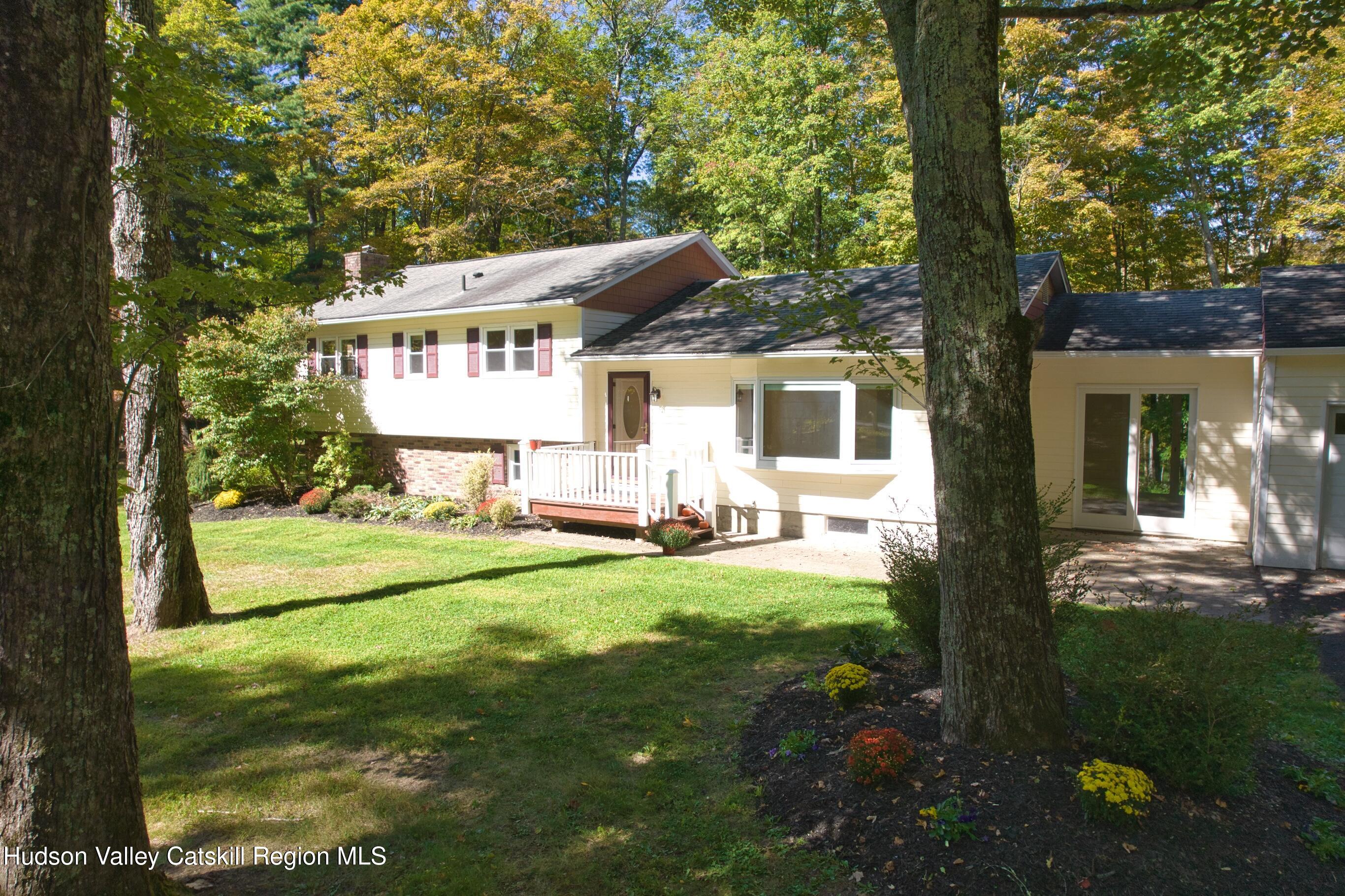 177 Buck Road Stone Ridge, NY 12484 - Photo 5 of 37 a view of a house with backyard sitting area and garden