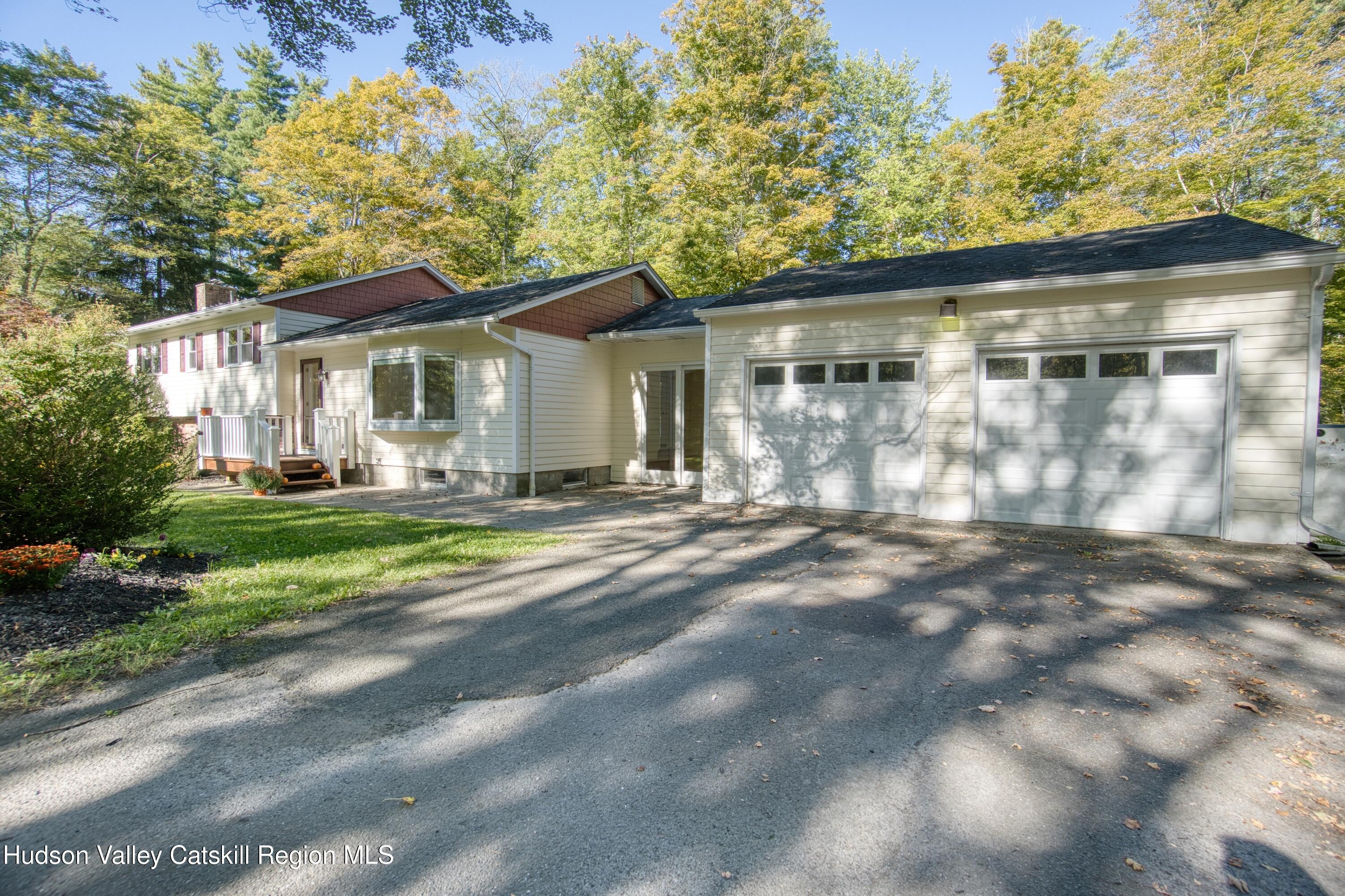 177 Buck Road Stone Ridge, NY 12484 - Photo 7 of 37 a front view of a house with a yard