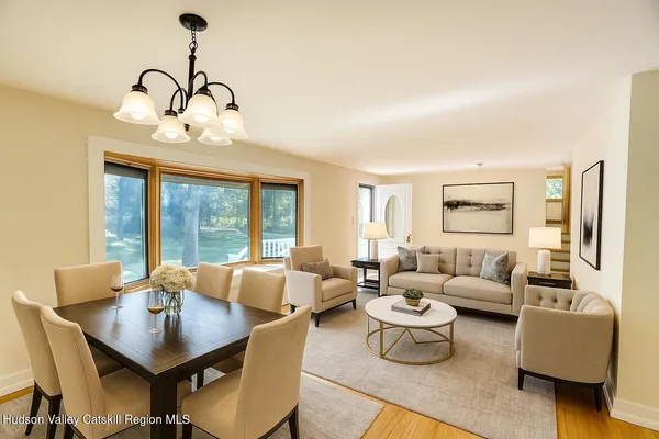 a dining room with furniture and window