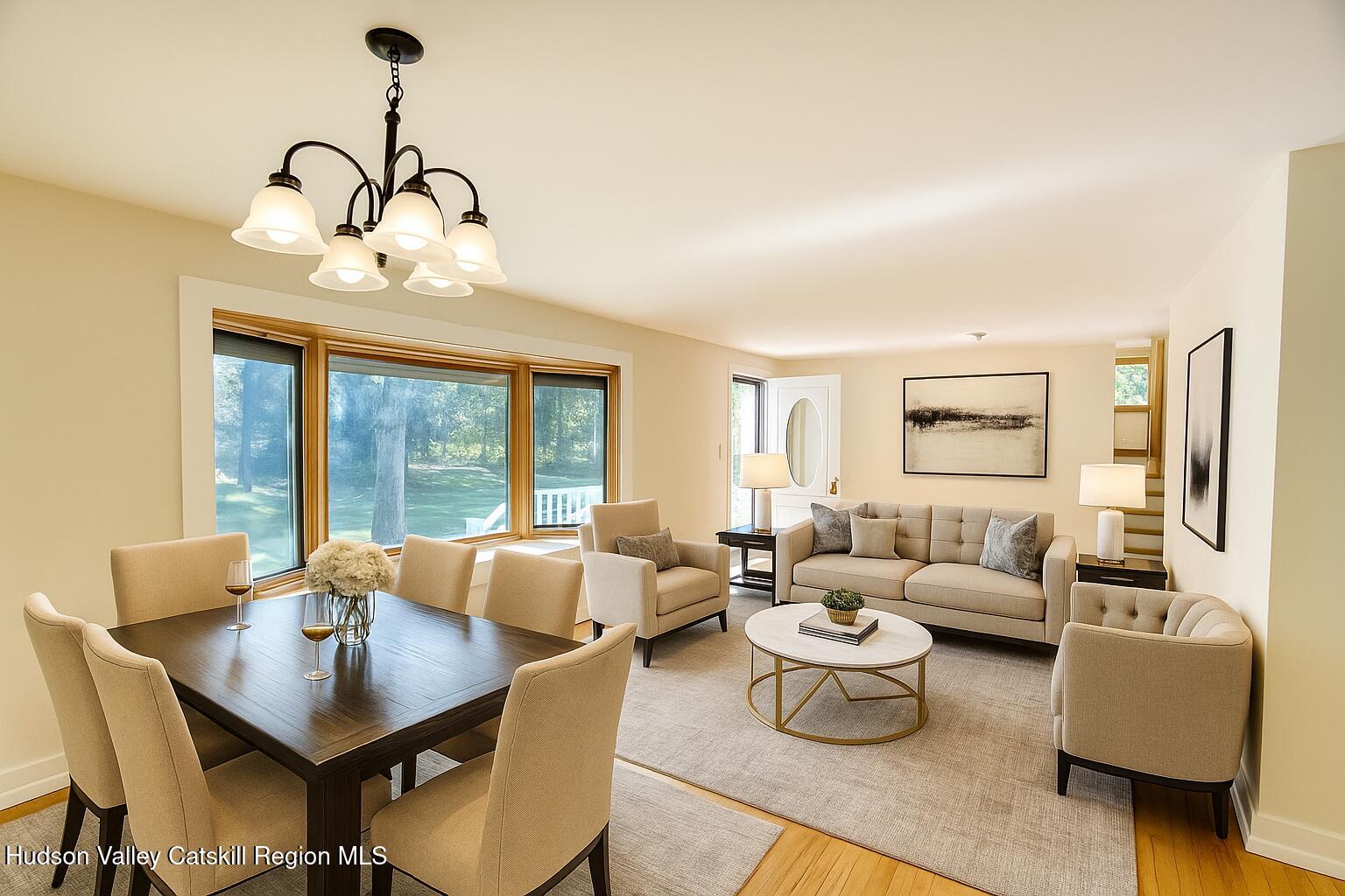 177 Buck Road Stone Ridge, NY 12484 - Photo 10 of 37 a living room with furniture chandelier and a table