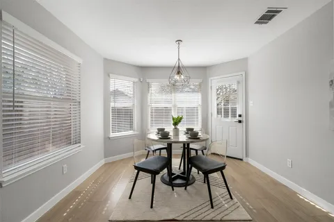 a view of a dining room with furniture window and outside view