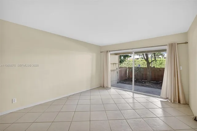 a view of an empty room and window