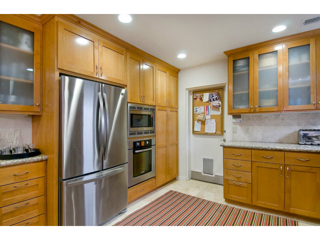 325 Princeton Road Menlo Park, CA 94025 - Photo 5 of 15 a kitchen with stainless steel appliances granite countertop a refrigerator and a stove top oven