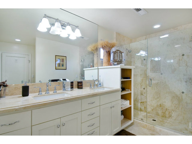 325 Princeton Road Menlo Park, CA 94025 - Photo 8 of 15 a bathroom with a sink a mirror and a shower