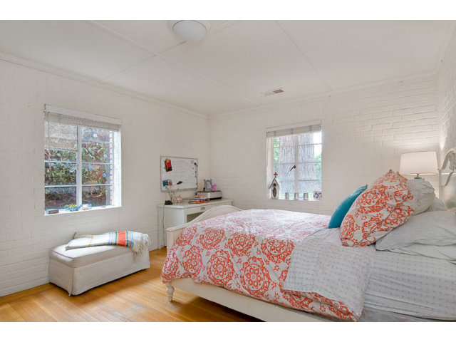 325 Princeton Road Menlo Park, CA 94025 - Photo 9 of 15 a bedroom with a bed window and wooden floor