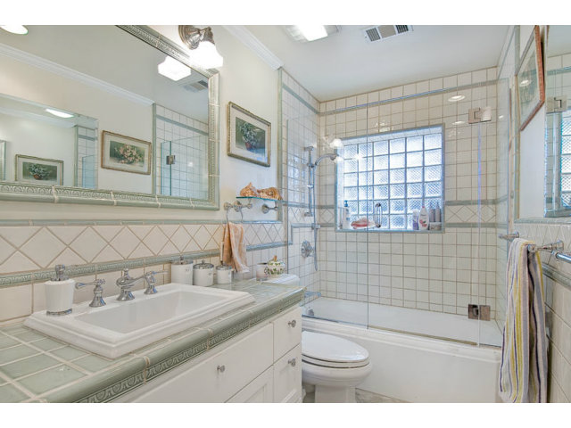 325 Princeton Road Menlo Park, CA 94025 - Photo 10 of 15 a bathroom with a sink a toilet a mirror and shower