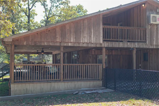 a view of a wooden door with wooden floor