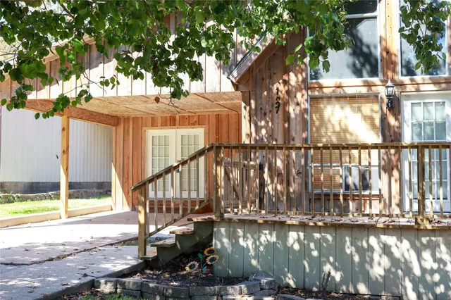 a view of a dining room with furniture and windows