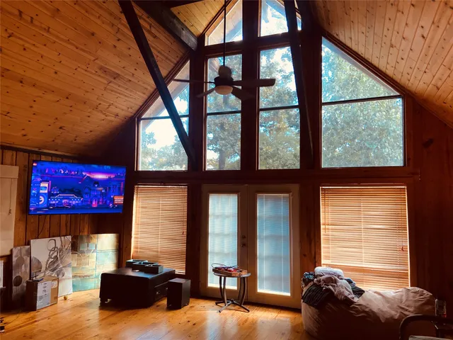 a bed room with furniture and a flat screen tv