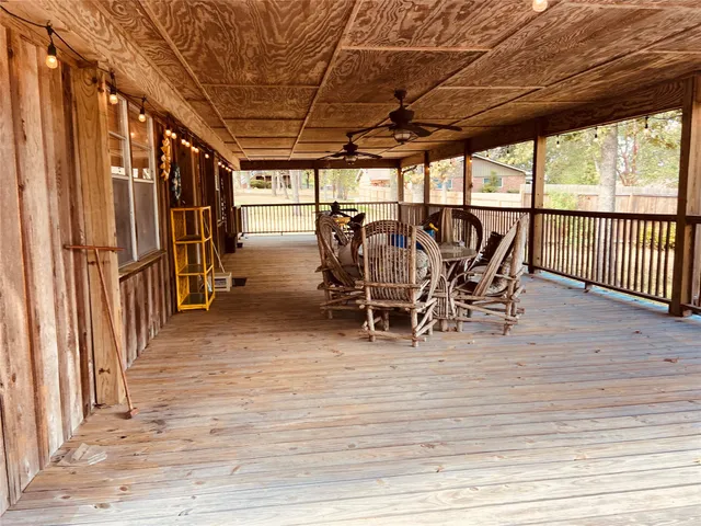 a view of a patio with table and chairs