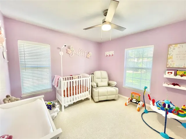 a bathroom with a sink vanity mirror and toilet