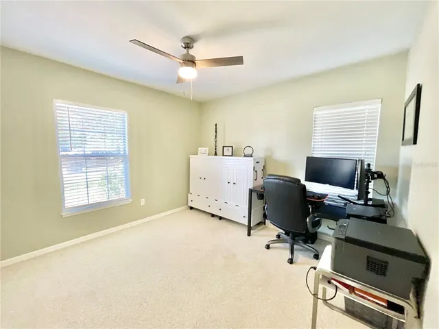 a view of a livingroom with a workspace