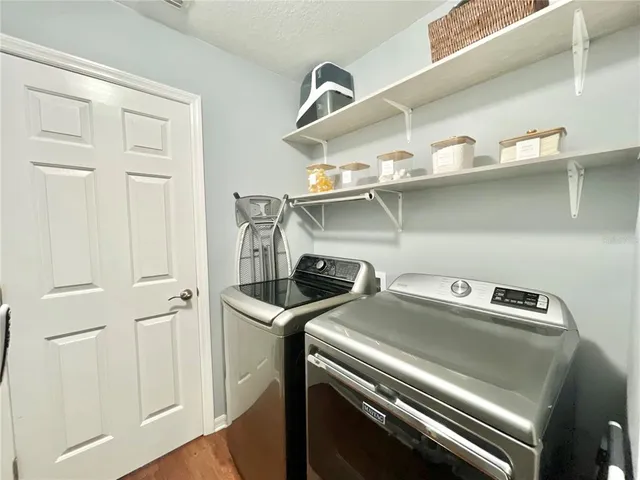 a utility room with dryer and washer