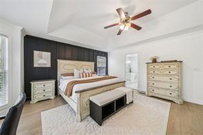 198 Celestial Run Winder, GA 30680 - Photo 11 of 30 a bedroom with a bed and a ceiling fan