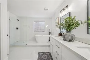 a bathroom with a sink a toilet and bathtub