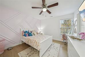 198 Celestial Run Winder, GA 30680 - Photo 19 of 30 a bedroom with a bed and a chandelier