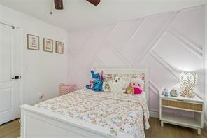 198 Celestial Run Winder, GA 30680 - Photo 20 of 30 a bedroom with a bed and a chandelier