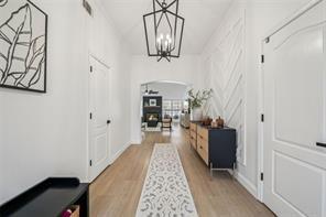 198 Celestial Run Winder, GA 30680 - Photo 23 of 30 a view of a hallway with wooden floor and staircase